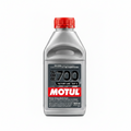 A 500ml bottle of MOTUL REF 700 Racing Brake Fluid, featuring a metallic silver body, a red cap, and a black and red label, set against a solid black background.