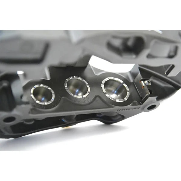 Detailed view of AP Racing Pro 5000R multi-piston brake caliper highlighting motorsport engineering